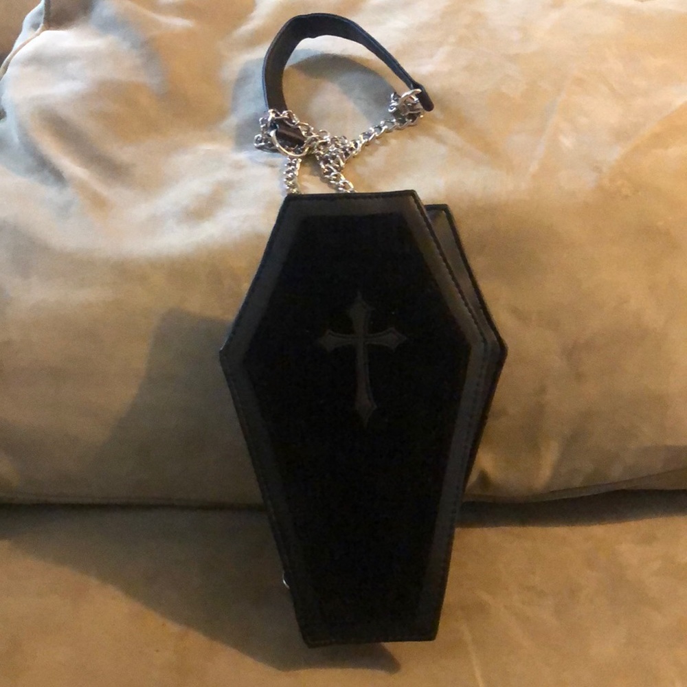 Black casket spirit casket purse with chain handle.